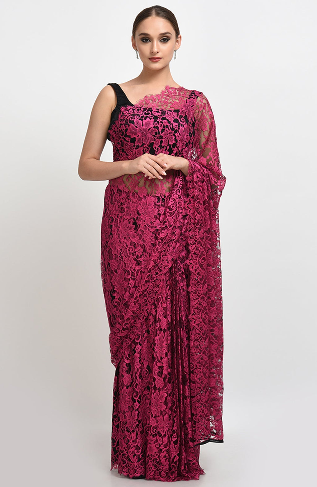 Raspberry saree made of French Chantilly lace with matching satin blouse fabric visible