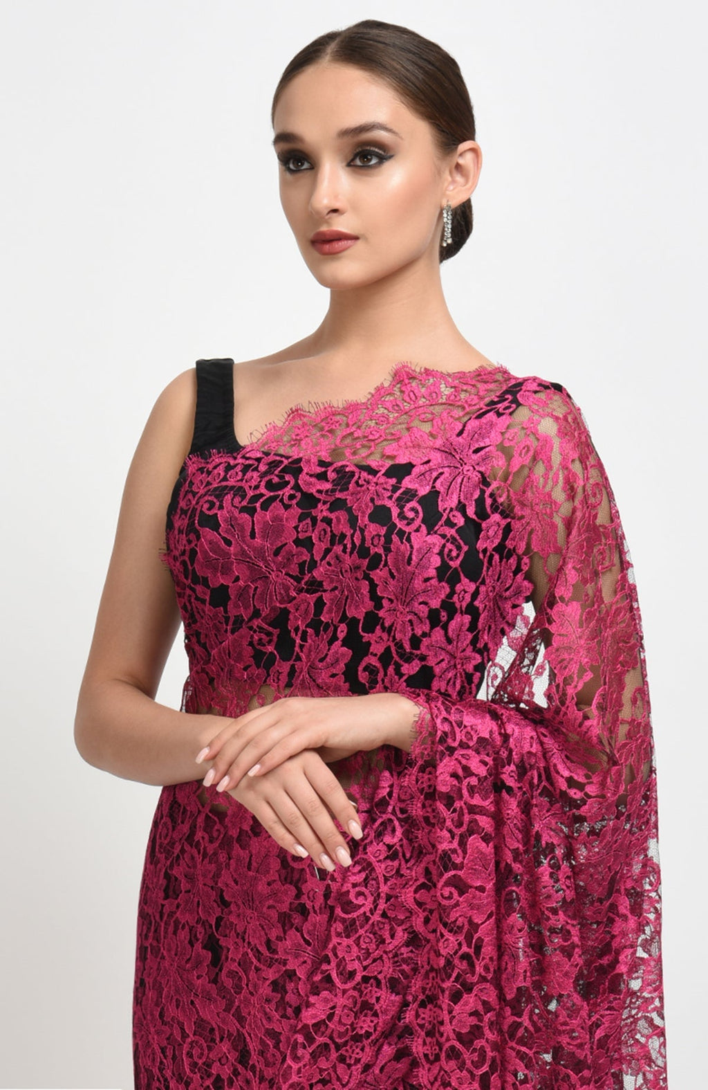 Raspberry saree made of French Chantilly lace with matching satin blouse fabric visible