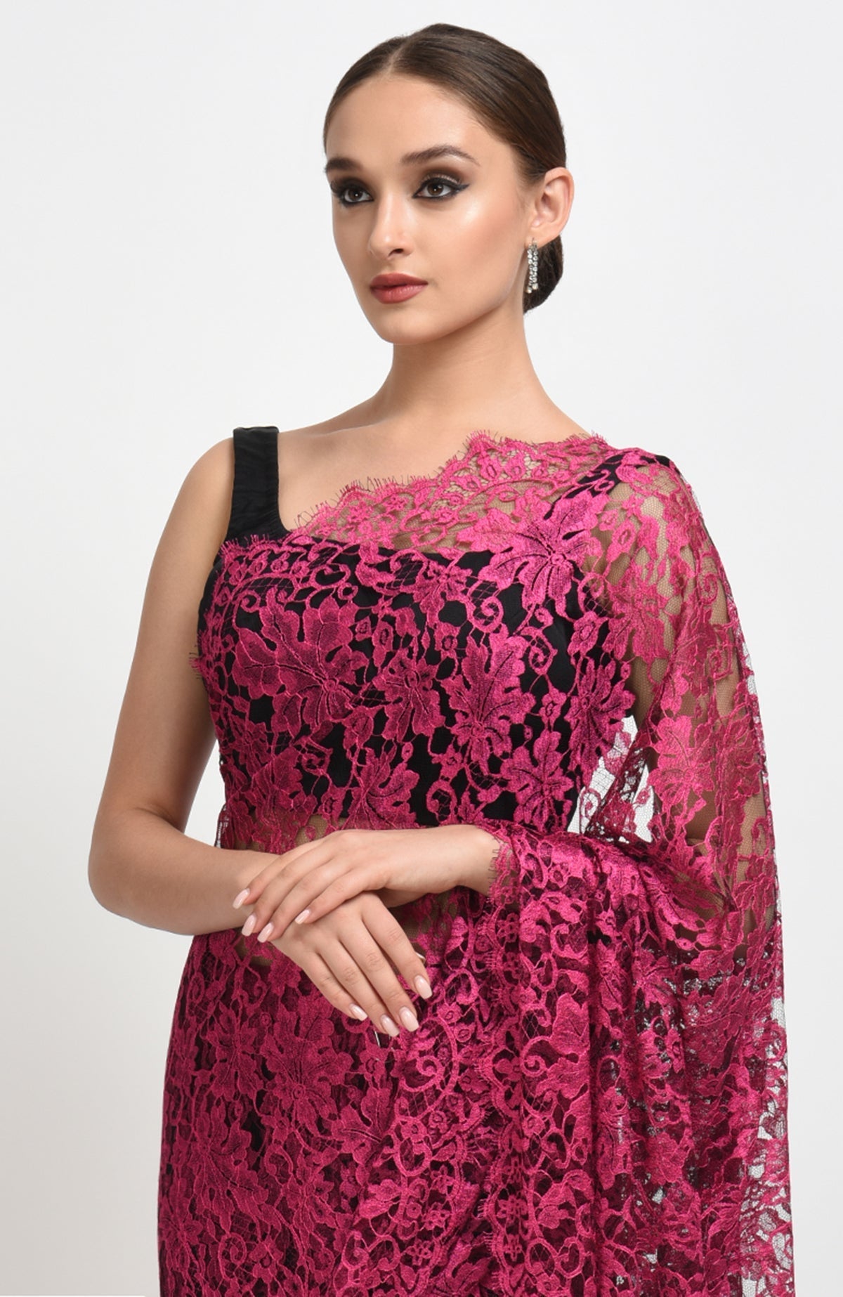 Raspberry saree made of French Chantilly lace with matching satin blouse fabric visible