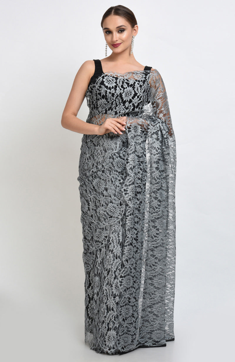 Silver grey saree made of French Chantilly lace with matching plain satin blouse fabric.