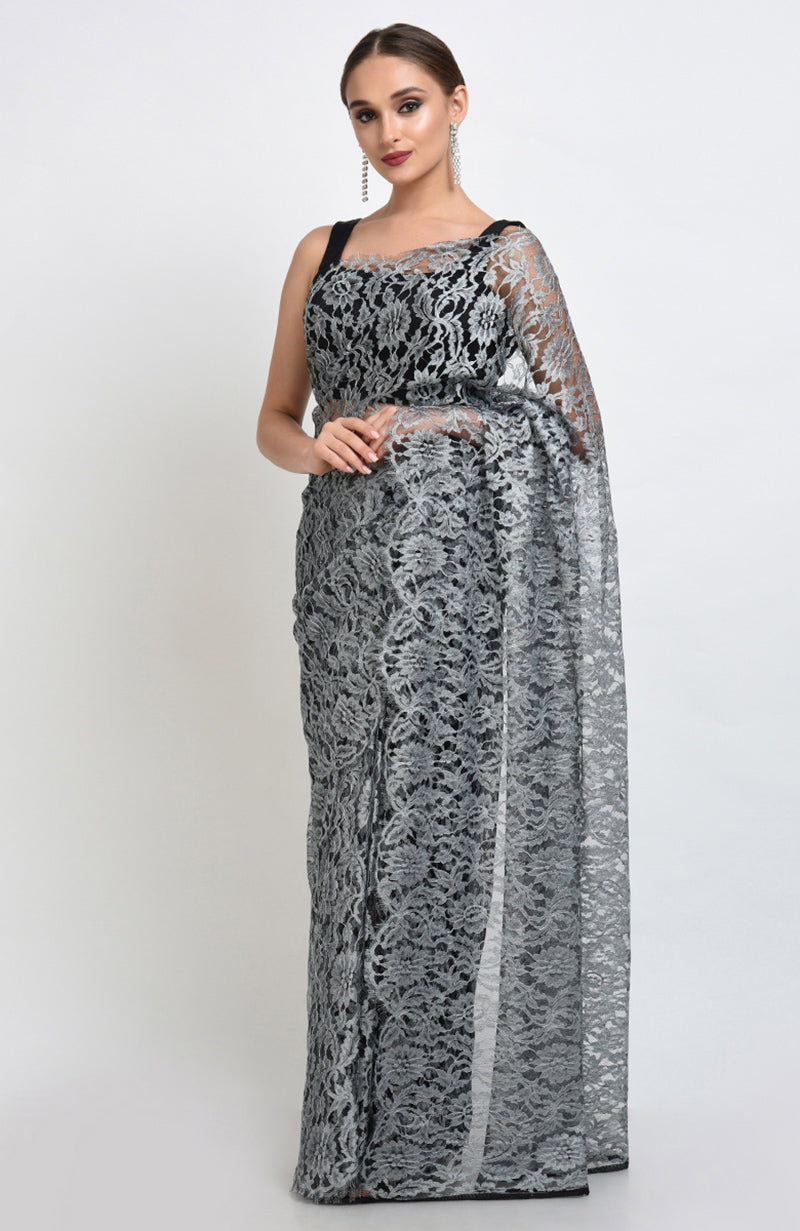 Silver grey saree made of French Chantilly lace with matching plain satin blouse fabric.