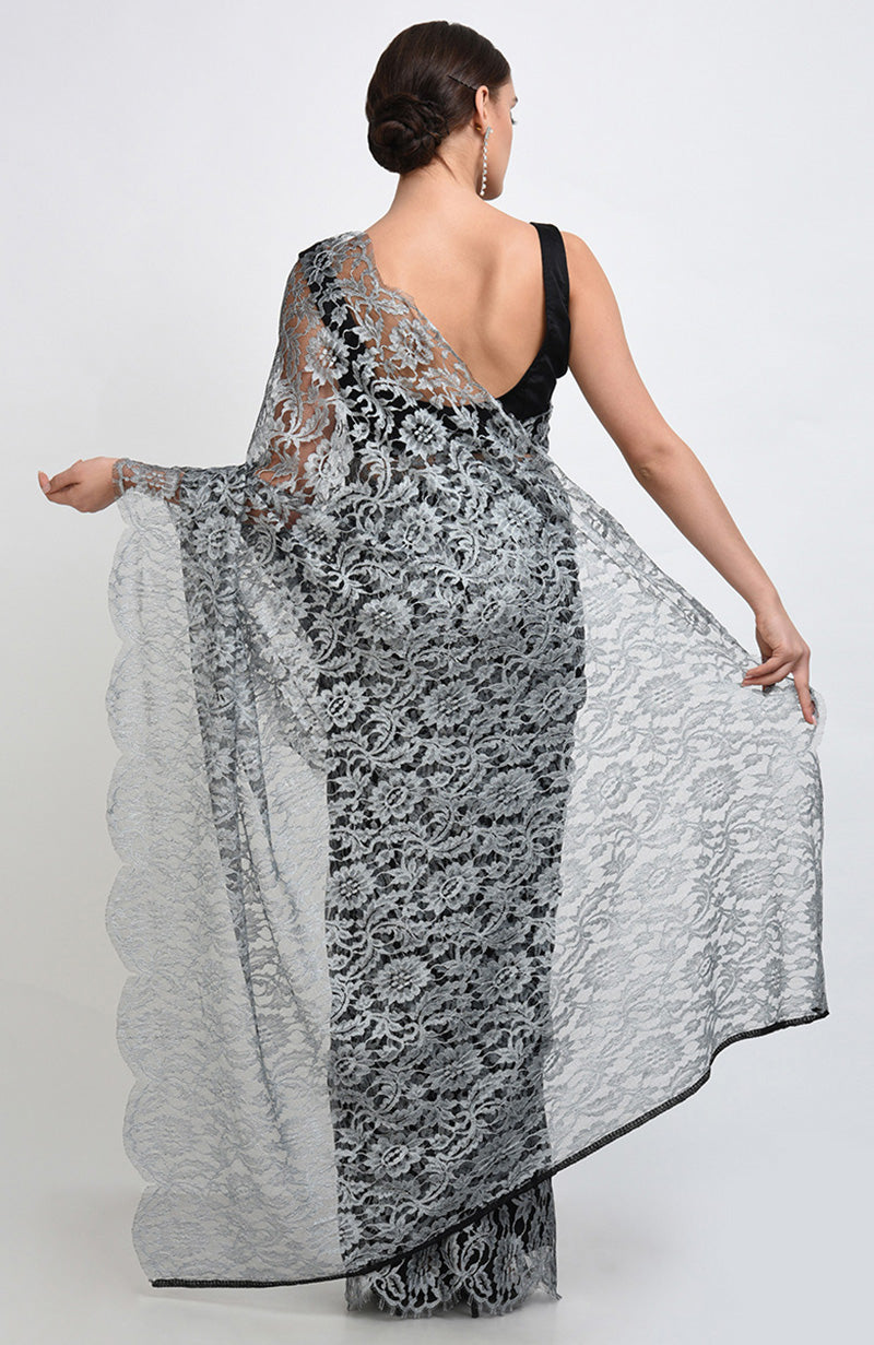 Silver grey saree made of French Chantilly lace with matching plain satin blouse fabric.