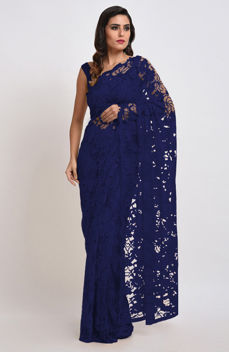 An elegant woman models an Eclipse Blue Chantilly Lace Saree Set.
