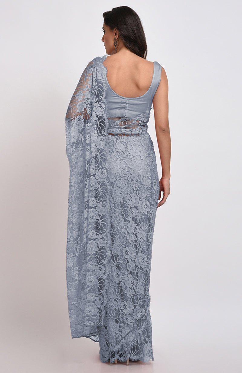 Blue gray Chantilly lace saree set with a matching satin blouse.
