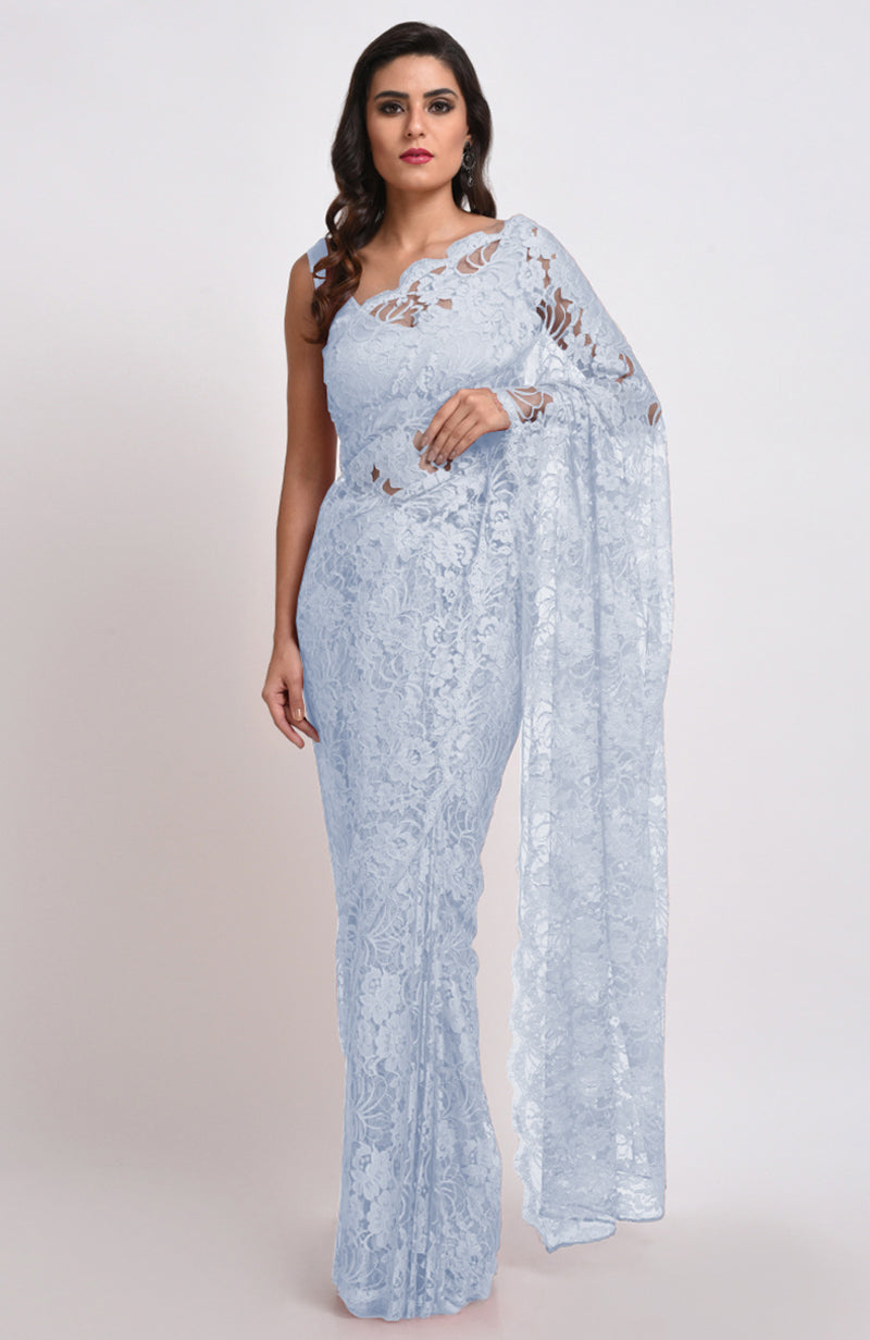 A woman models an Illusion Blue French Chantilly Lace Saree Set.