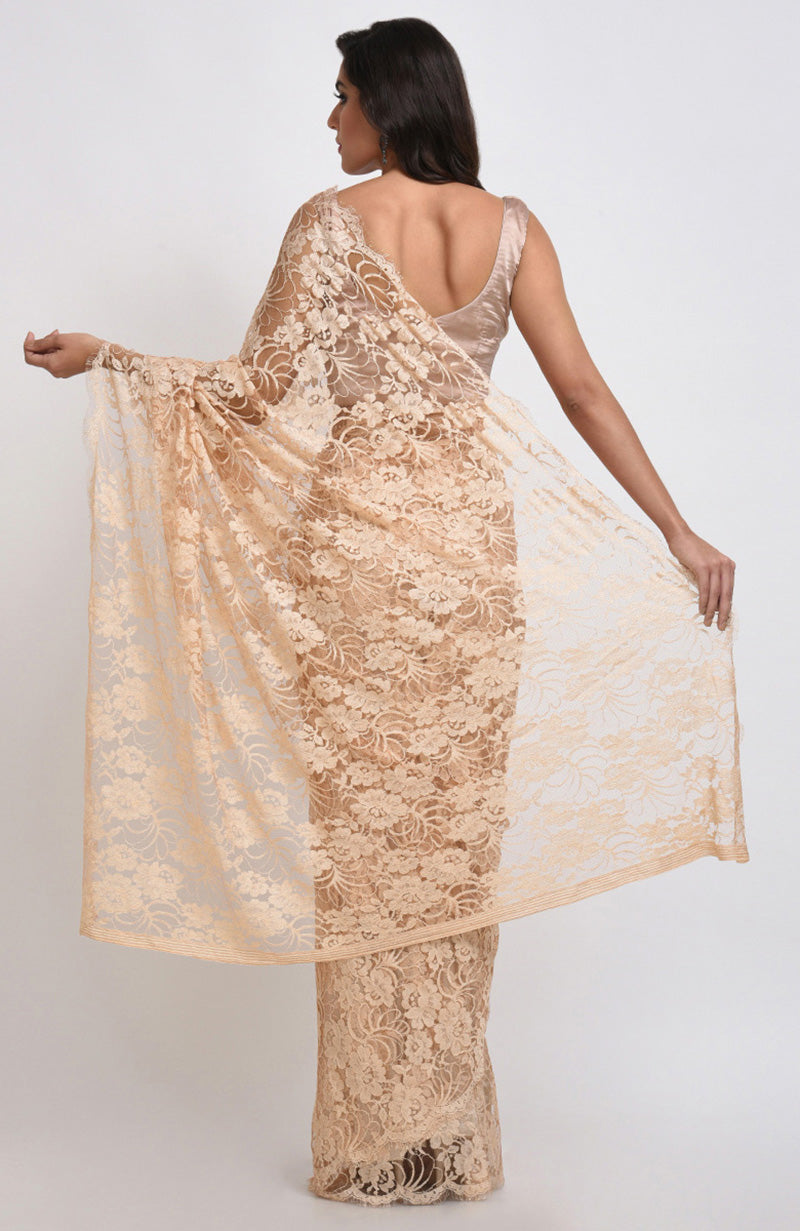 Nude saree with delicate French Chantilly lace and matching satin blouse fabric visible