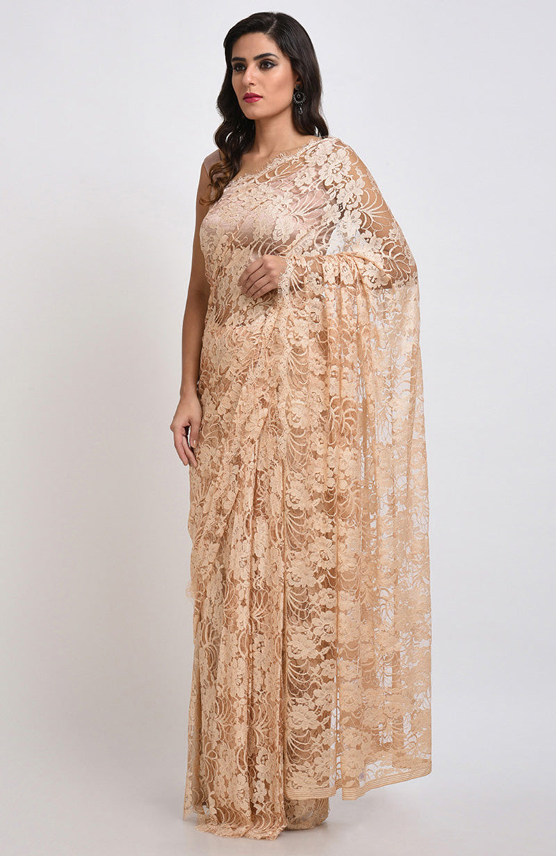 Nude saree made of French Chantilly lace with matching satin blouse fabric visible.