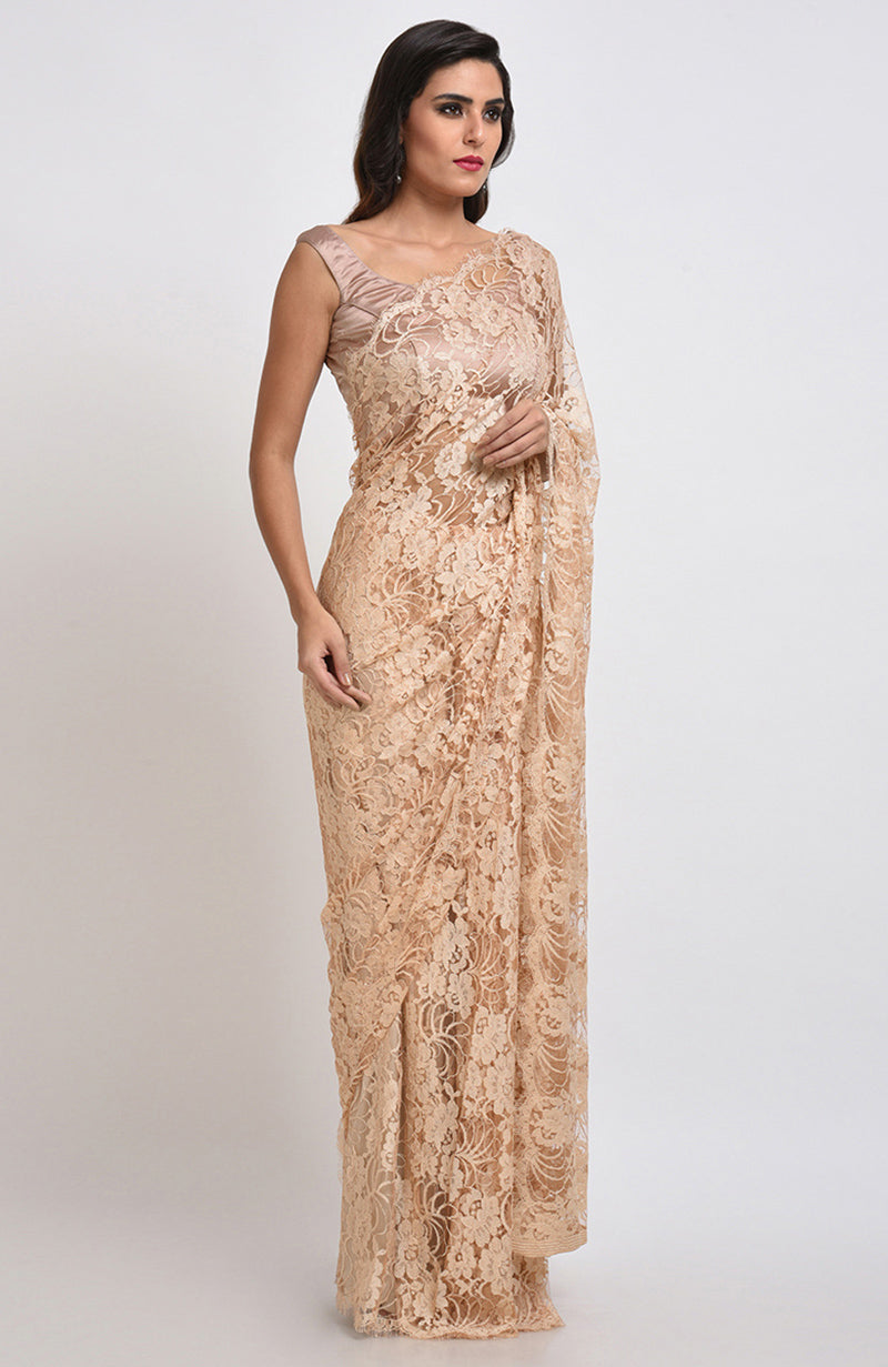 Nude saree made of French Chantilly lace with matching satin blouse fabric visible.