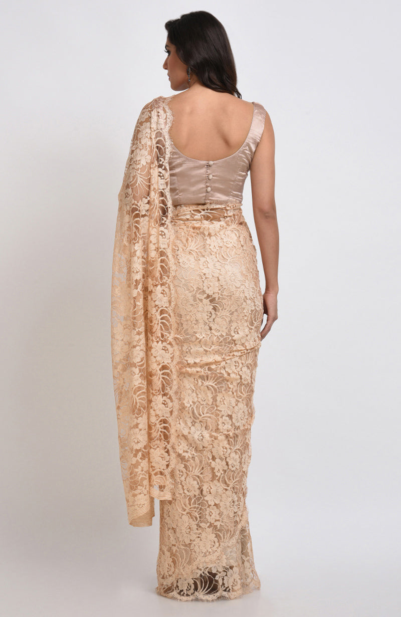 Nude saree set made of French Chantilly lace with matching satin blouse fabric visible