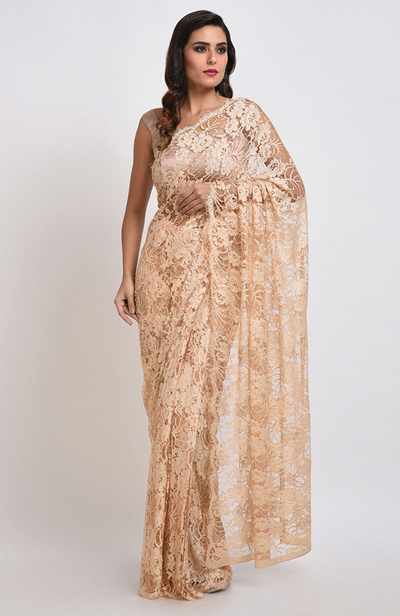 Nude saree made of French Chantilly lace with matching satin blouse fabric visible.