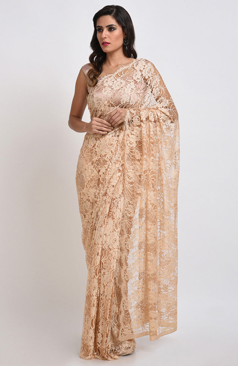 Nude saree made of French Chantilly lace with matching satin blouse fabric visible