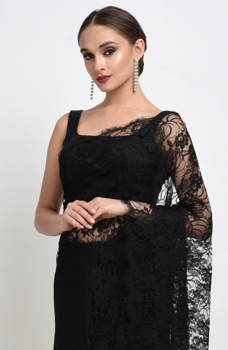 Black saree made of French Chantilly lace with matching satin blouse fabric visible