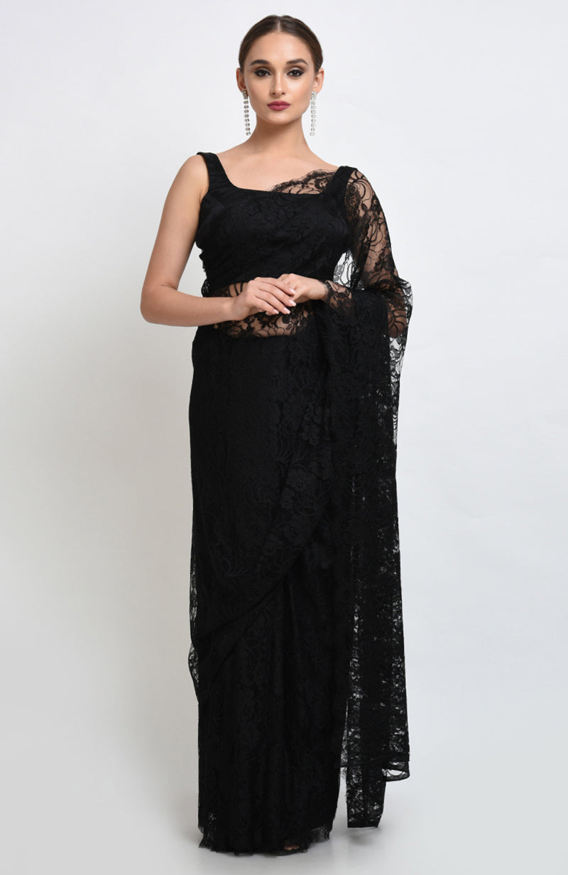 Black saree made of French Chantilly lace with matching satin blouse fabric visible.