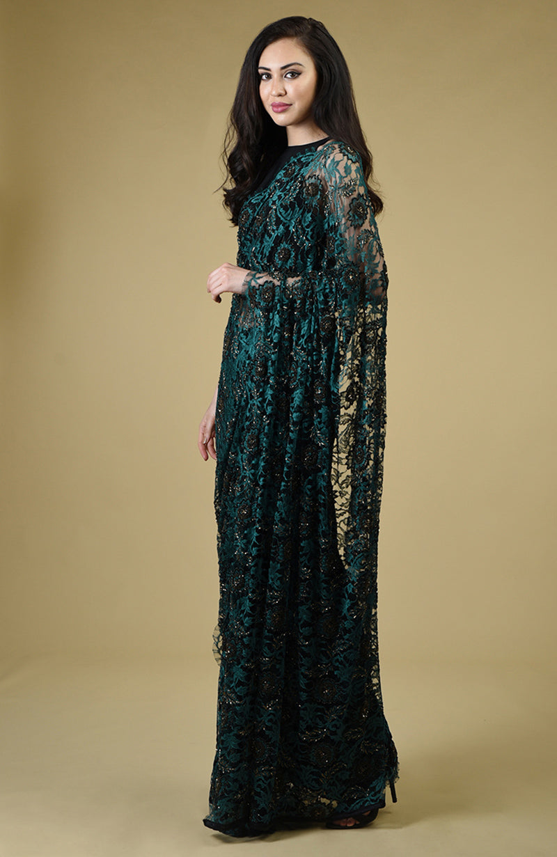Peacock green French Chantilly lace saree with black and gold bead embroidery and matching blouse fabric