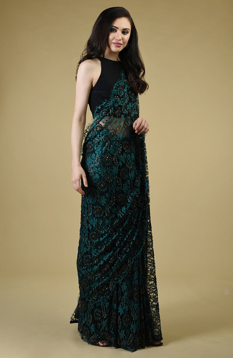 Peacock green French Chantilly lace saree with black and gold bead embroidery and matching blouse fabric