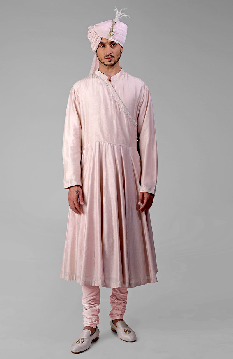 Barely pink chikankari embellished bandhgala and angarkha kurta set with churidar pants.