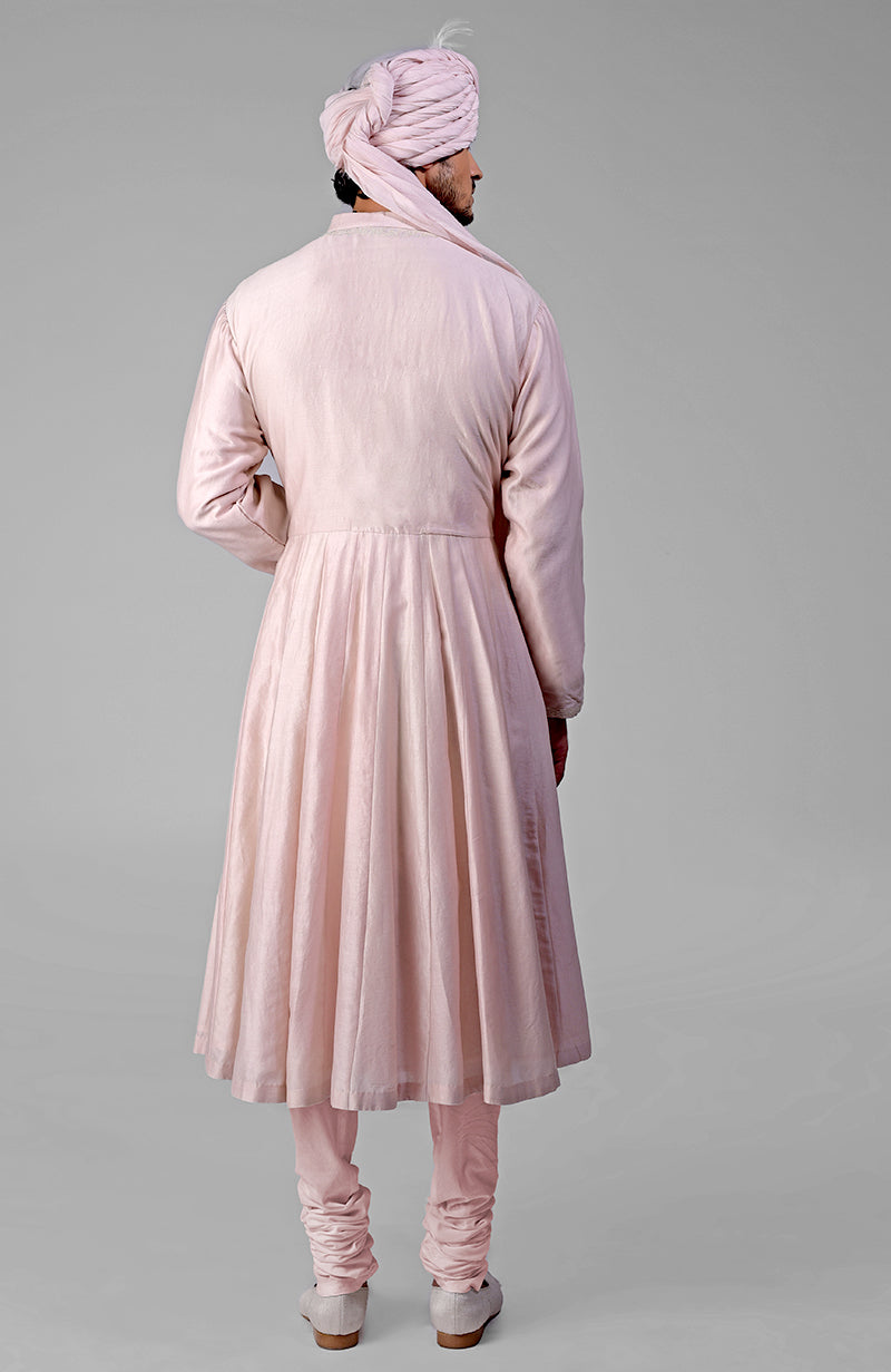 Barely pink chikankari embellished bandhgala and angarkha kurta set, viewed from the back.