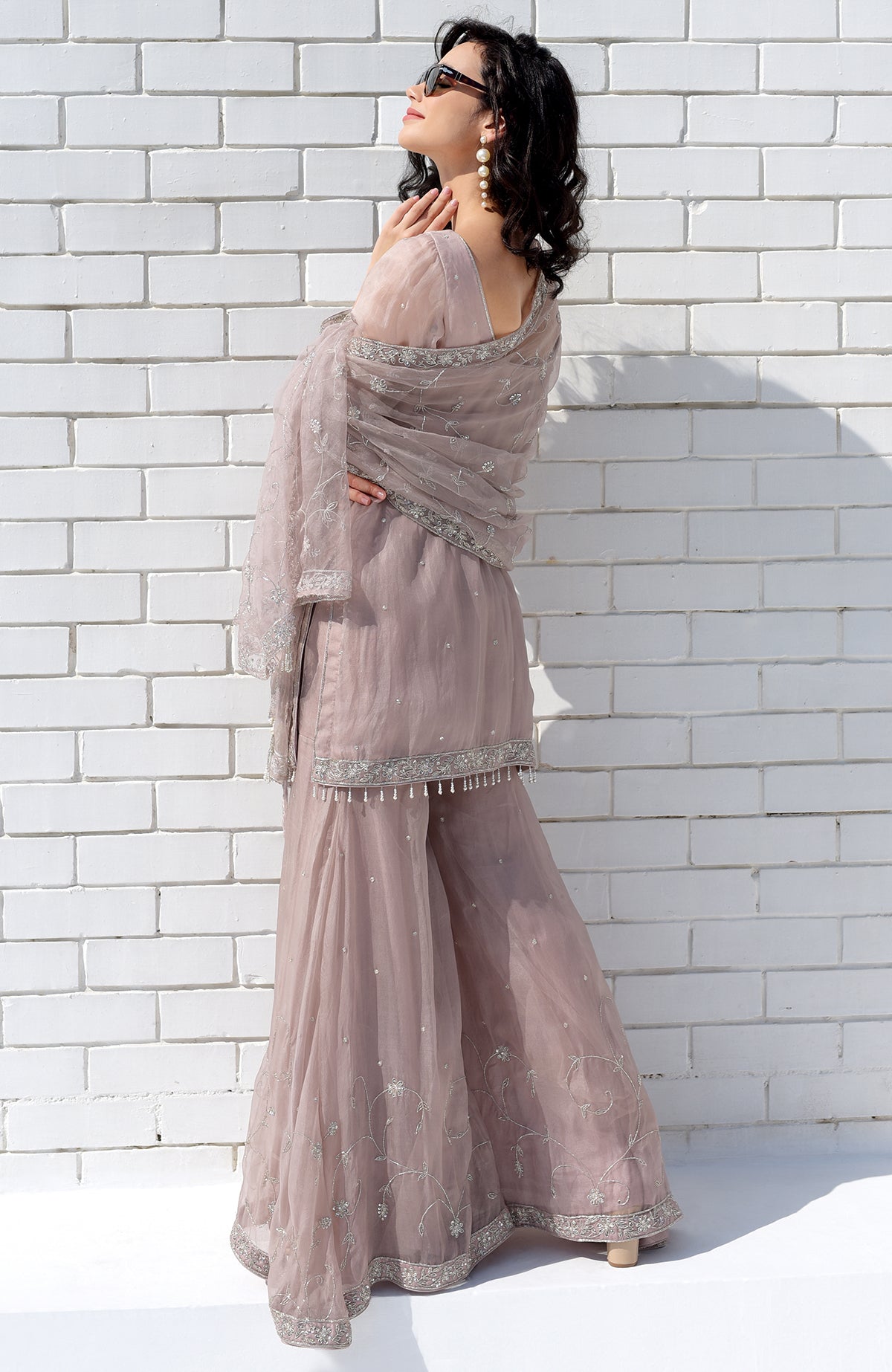 Oyster pink silk organza sharara set with hand-embroidered bead zardozi and beaded tassels