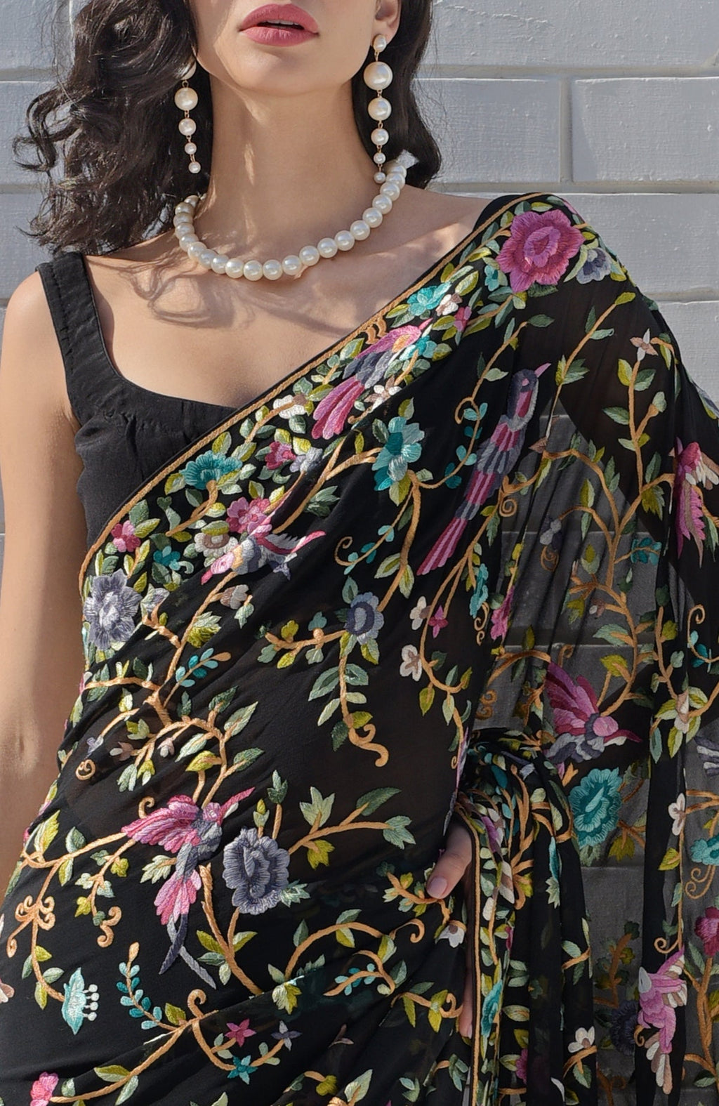 Black georgette saree with hand embroidered Parsi Gara birds and floral patterns