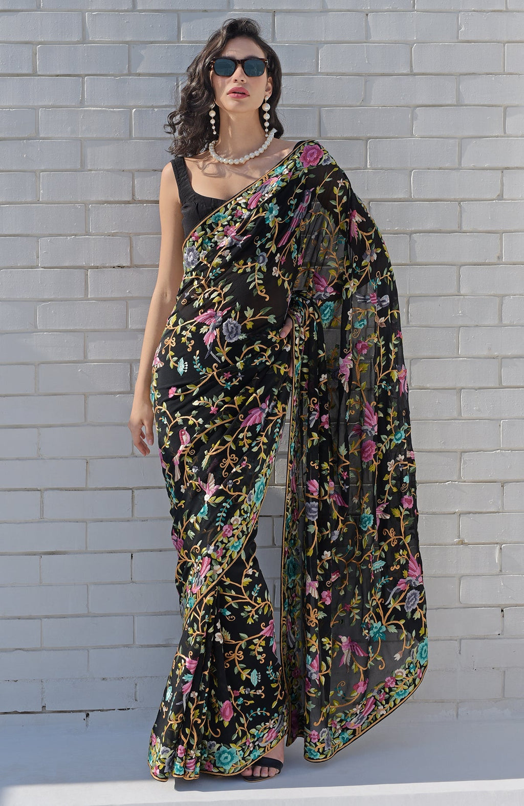 Black georgette saree with hand embroidered Parsi Gara birds and floral patterns