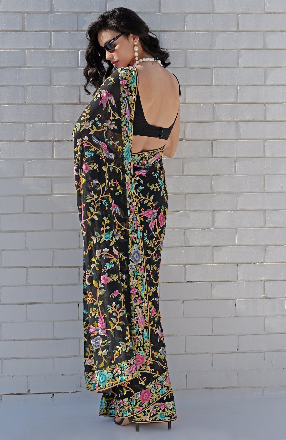 Black georgette saree with hand embroidered Parsi Gara birds and floral patterns
