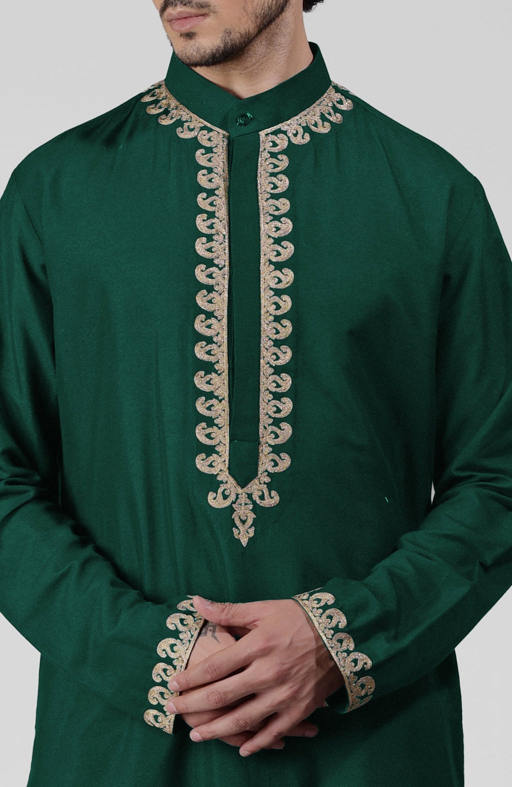 Emerald green silk kurta with gold Kashmiri tilla embroidery and matching pathani salwar set