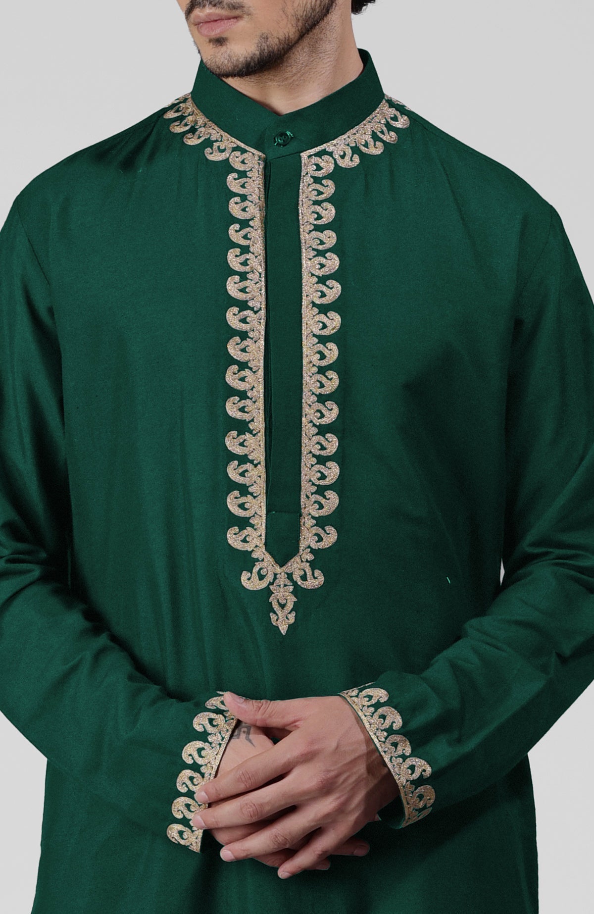 Emerald green silk kurta with gold Kashmiri tilla embroidery and matching pathani salwar set