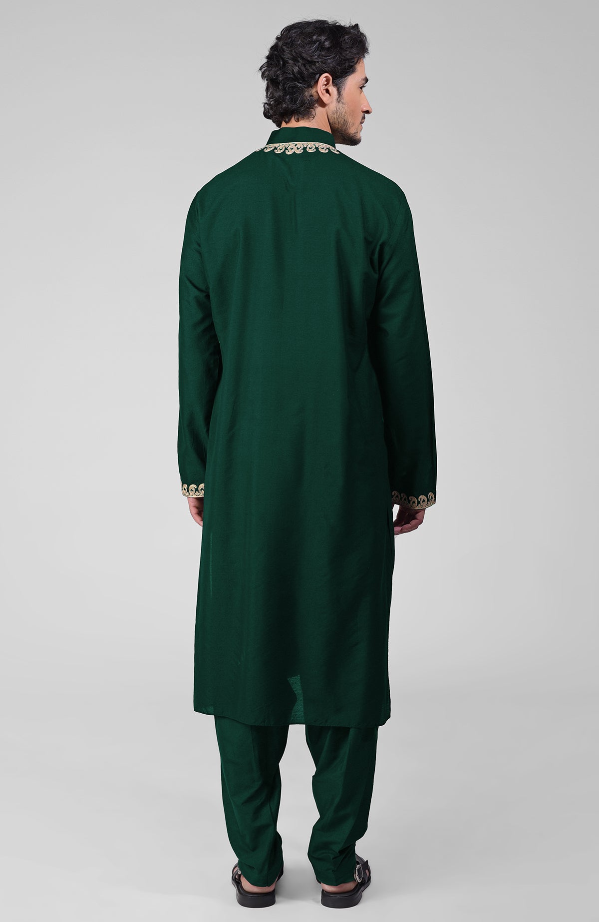 Emerald green silk kurta with gold Kashmiri tilla embroidery and matching pathani salwar.