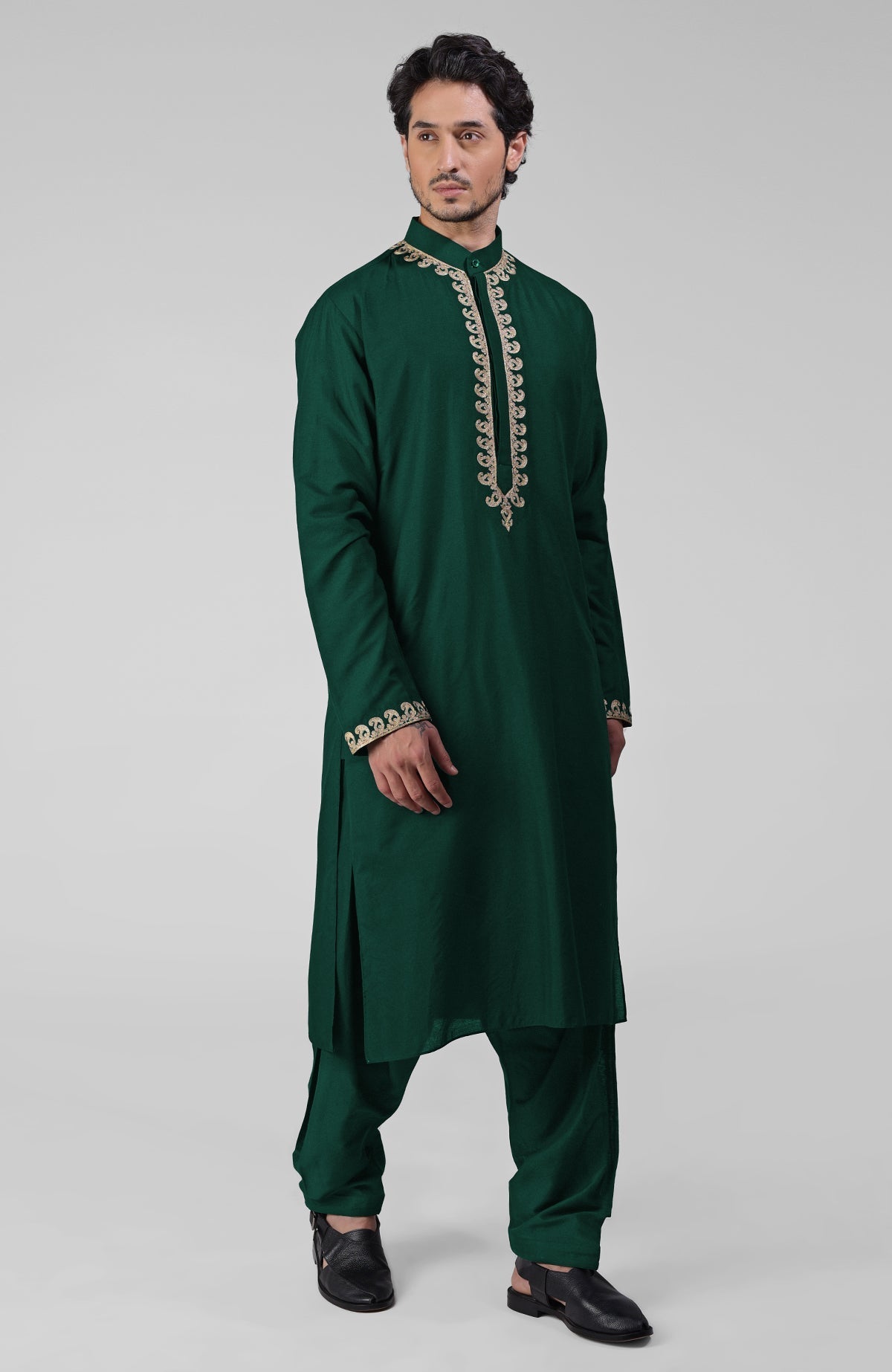 Emerald green silk kurta with gold Kashmiri tilla embroidery and matching pathani salwar set.