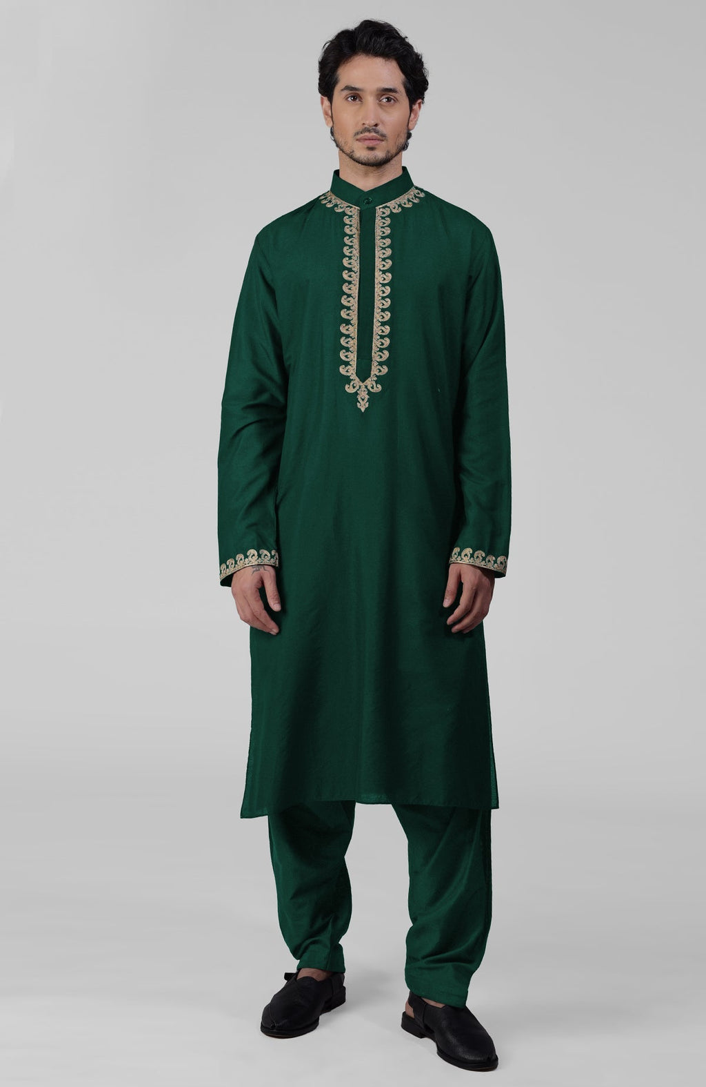 Emerald green silk kurta with gold Kashmiri tilla embroidery paired with matching salwar.