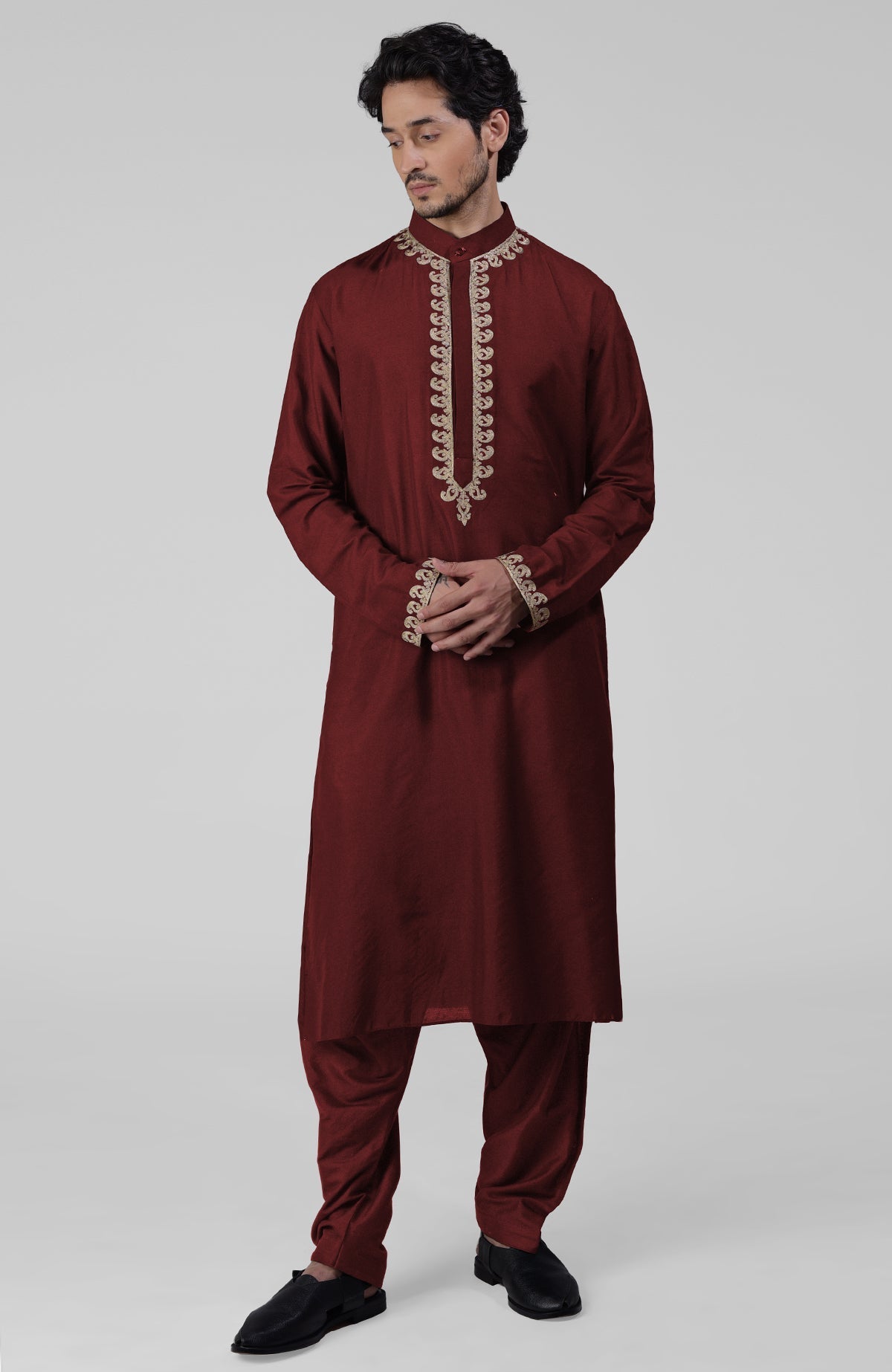 Maroon silk kurta set with intricate gold Kashmiri Tilla hand embroidery and matching salwar.