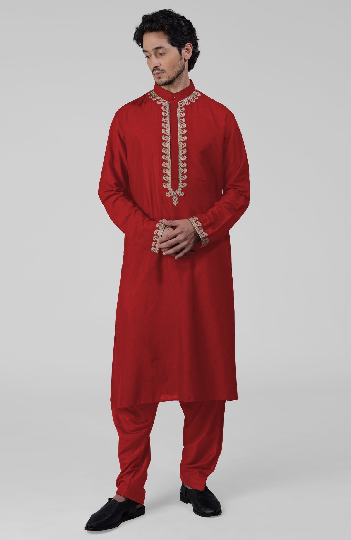 Red silk kurta set with intricate gold Kashmiri tilla embroidery and matching pathani salwar.