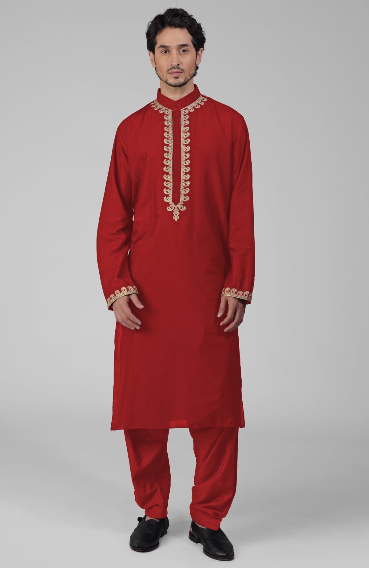 Teal silk kurta with gold Kashmiri tilla embroidery paired with matching pathani salwar.