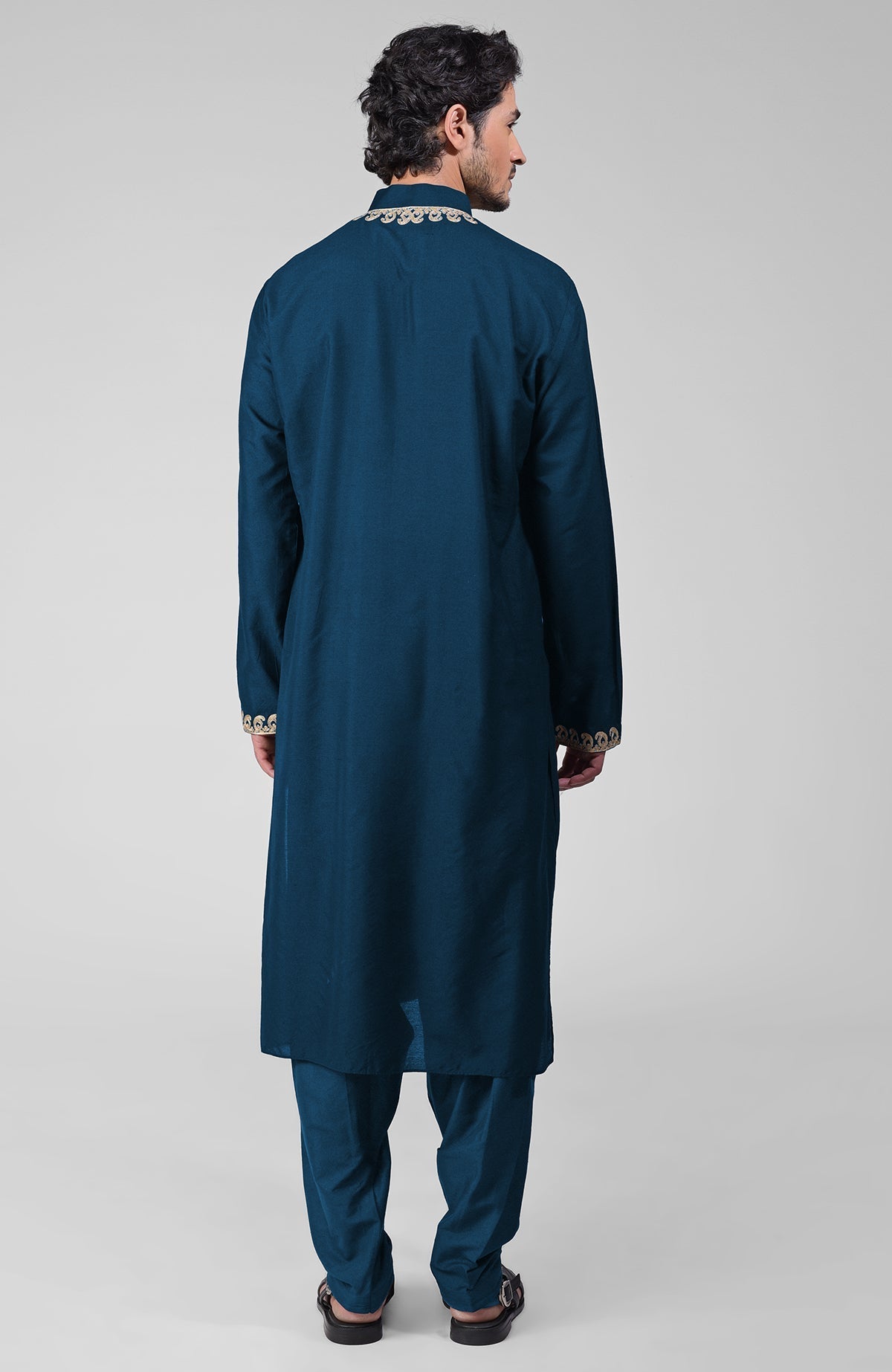 Teal silk kurta with gold Kashmiri tilla embroidery and matching pathani salwar set.