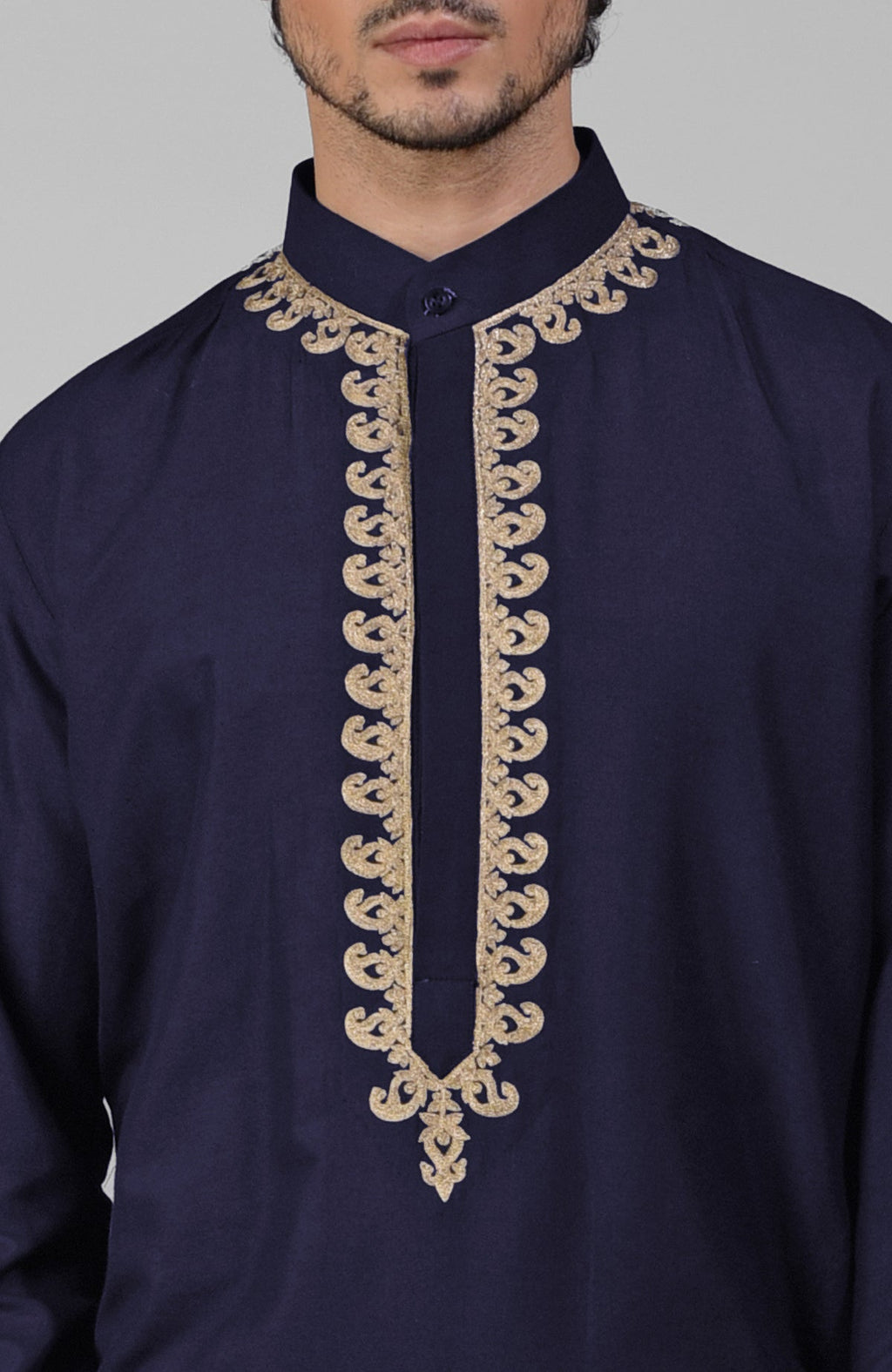Navy blue silk kurta with gold Kashmiri tilla embroidery paired with matching pathani salwar.