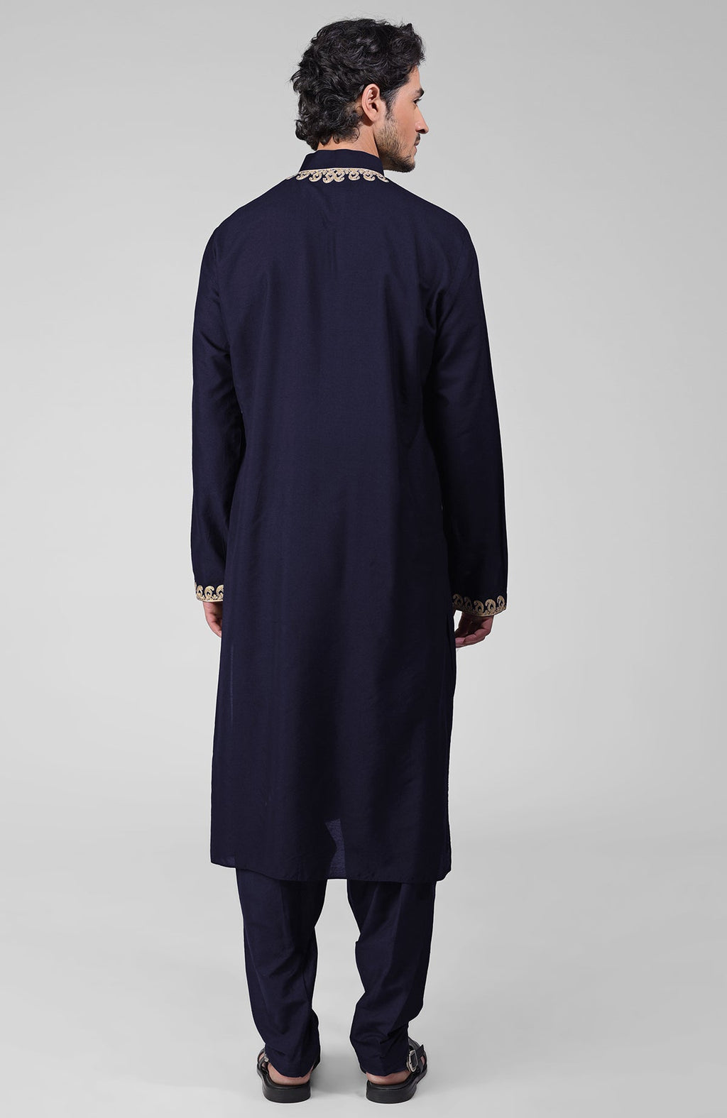 Navy blue silk kurta with gold Kashmiri tilla embroidery and matching pathani salwar.