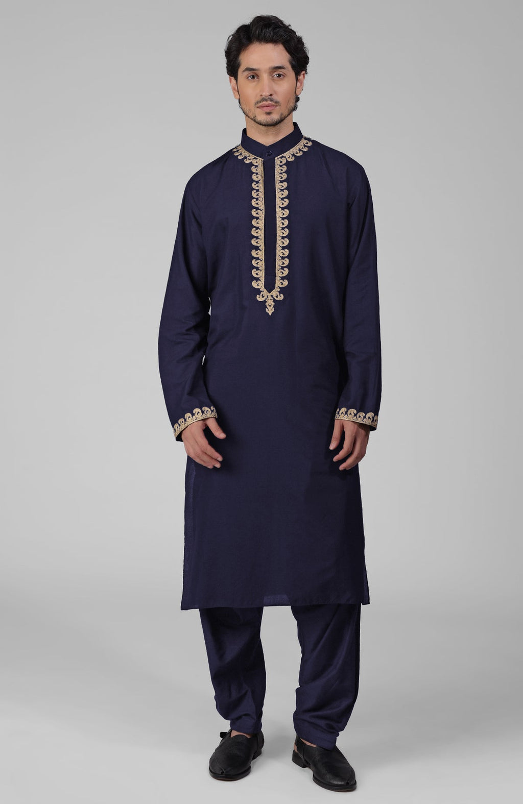Navy blue silk kurta with gold Kashmiri tilla embroidery paired with matching pathani salwar.