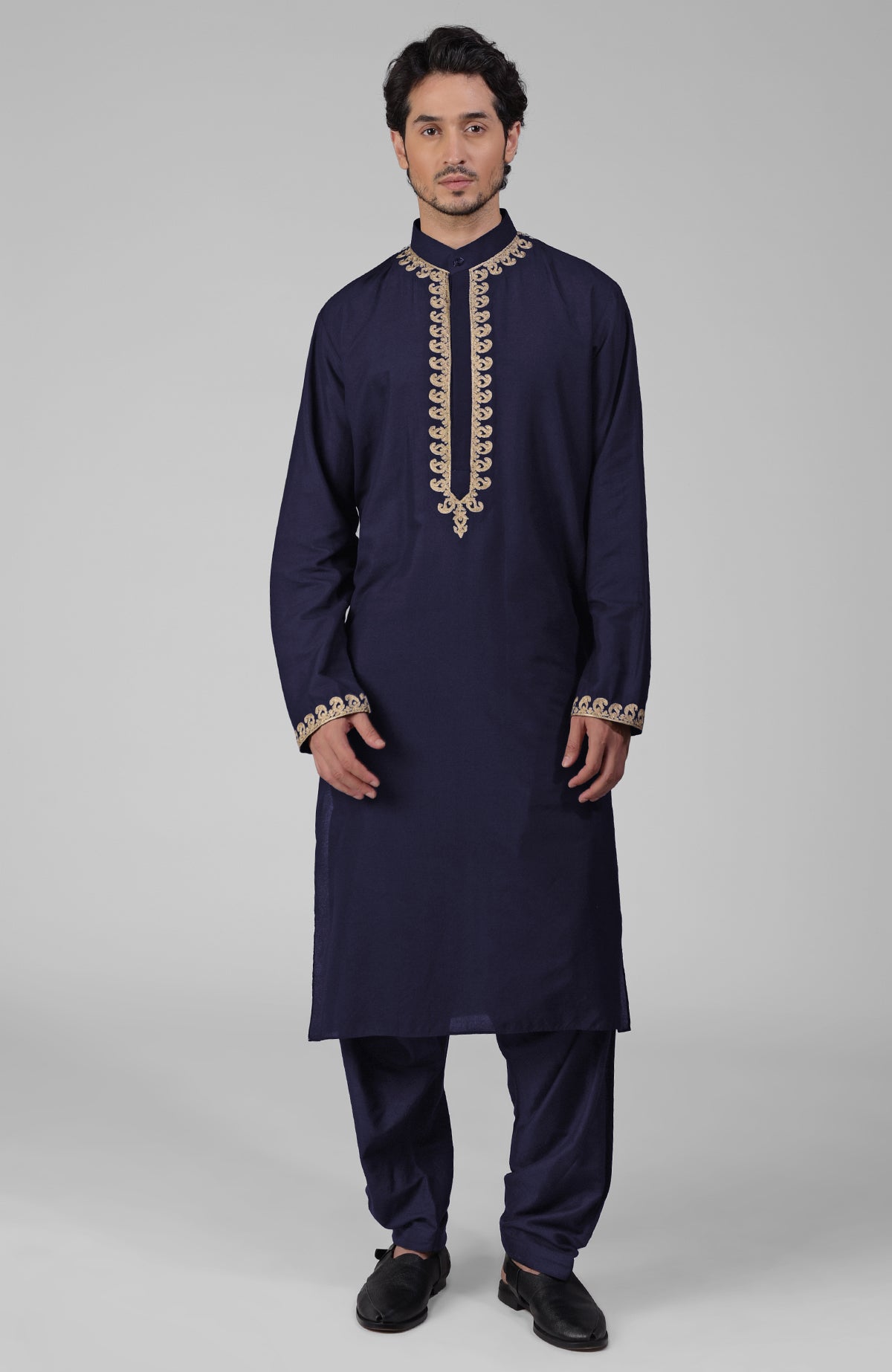 Teal silk kurta with gold Kashmiri tilla embroidery paired with matching pathani salwar.