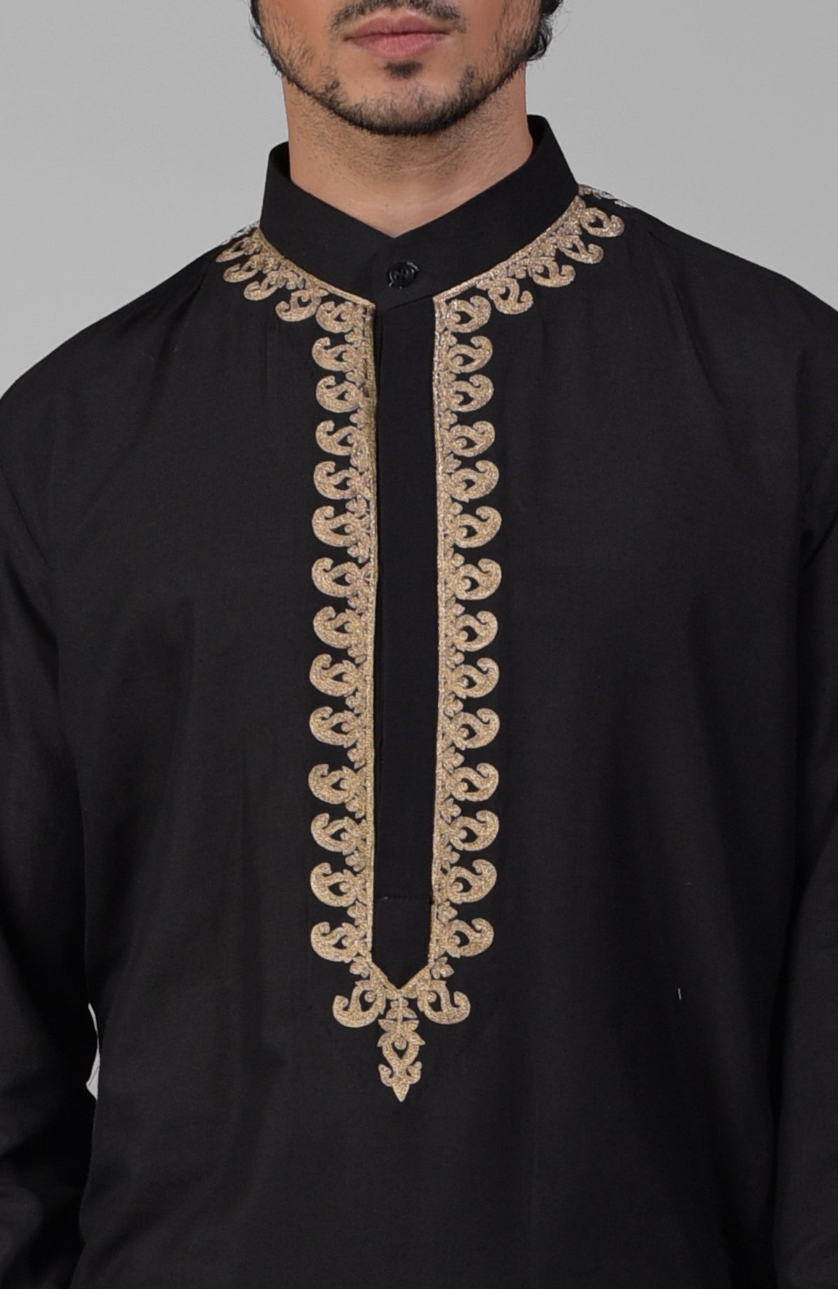 Black silk kurta set with gold Kashmiri tilla embroidery and matching pathani salwar.