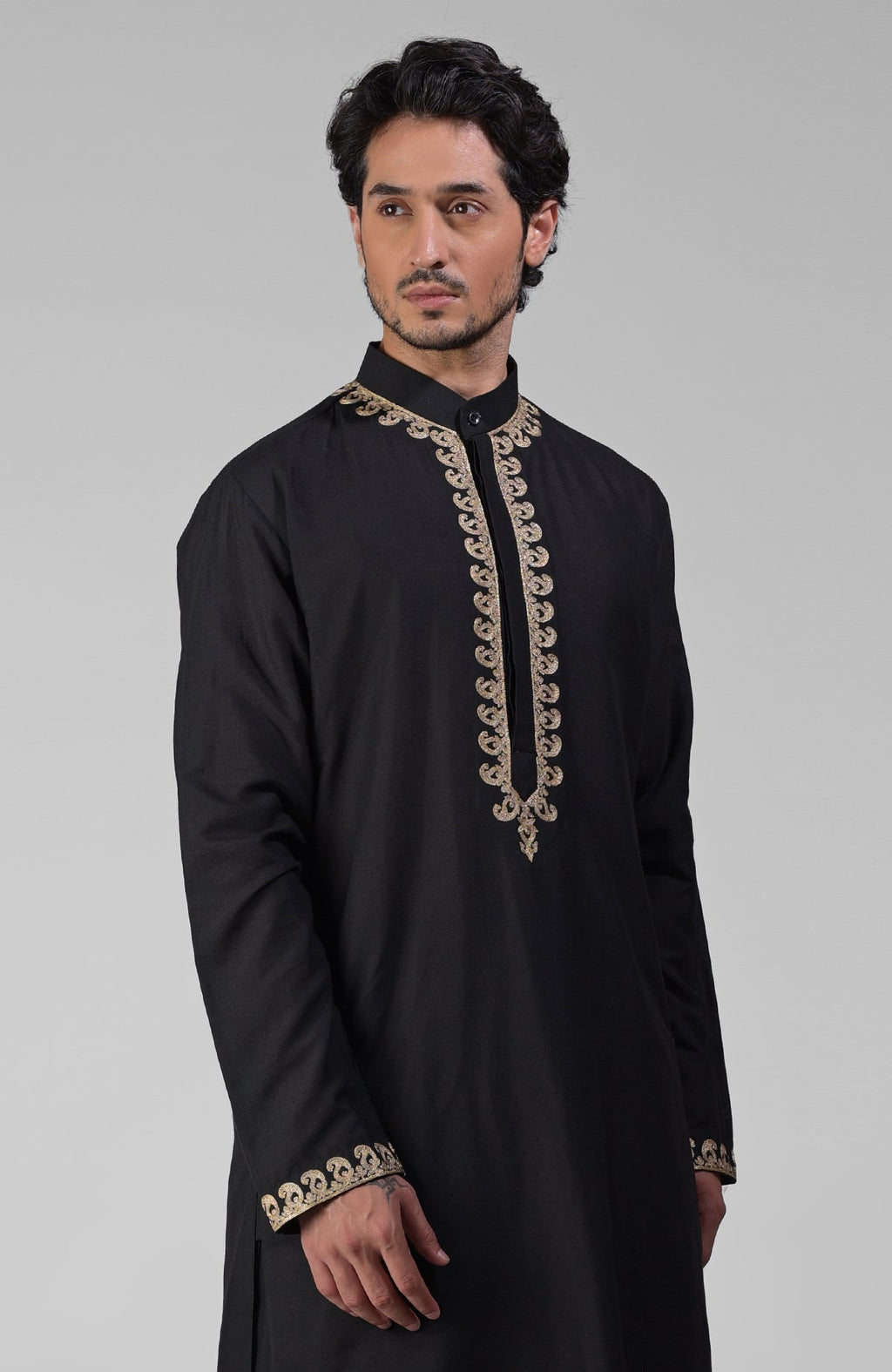Black silk kurta set with gold Kashmiri tilla embroidery and matching pathani salwar.
