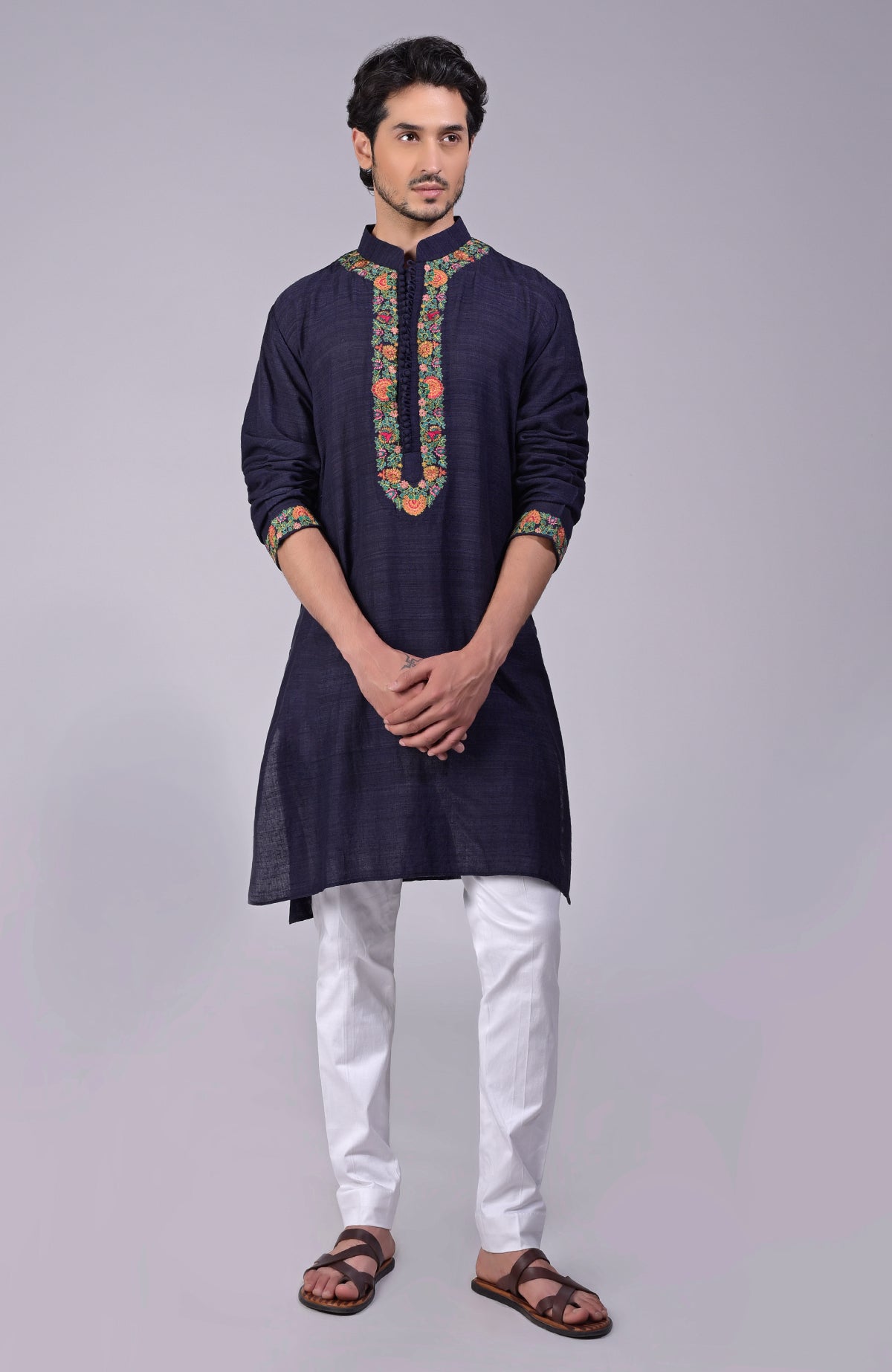 Olive kurta with intricate Kashidakari embroidery on placket, neckline, and sleeves.