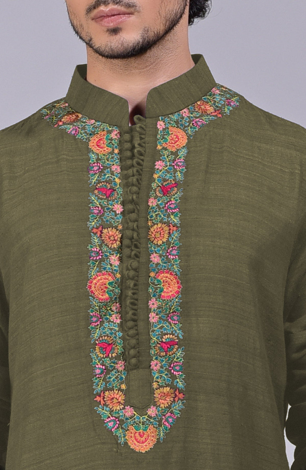 Olive kurta with Kashidakari embroidery on placket, neckline, and sleeve ends