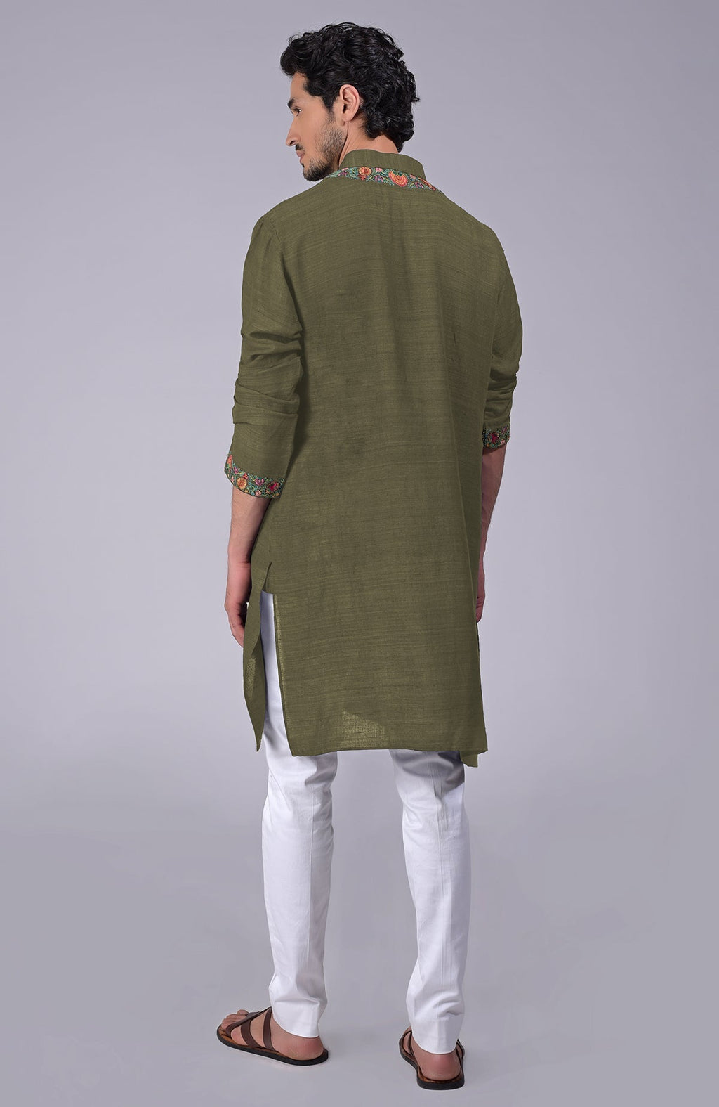 Olive kurta with intricate Kashidakari embroidery on placket, neckline, and sleeves.
