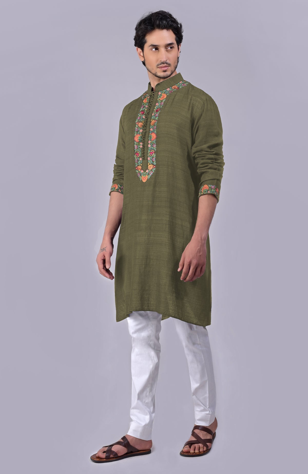 Olive kurta with detailed Kashidakari embroidery on placket, neckline, and sleeves.