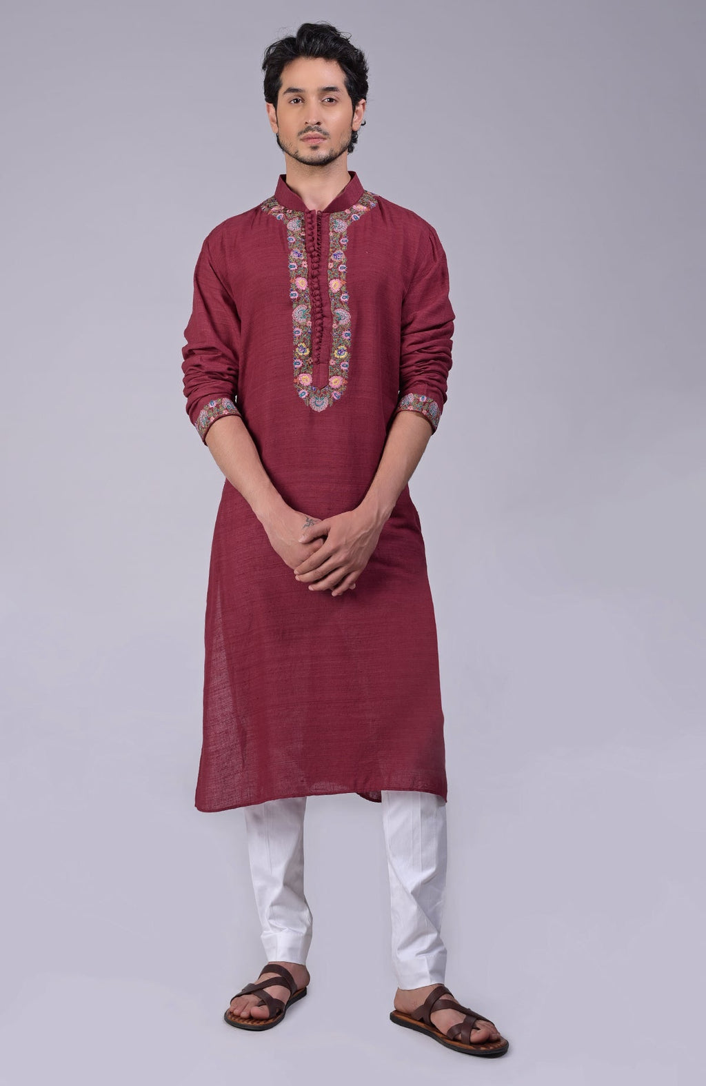 Maroon kurta with detailed Kashidakari embroidery on placket, neckline, and sleeves.