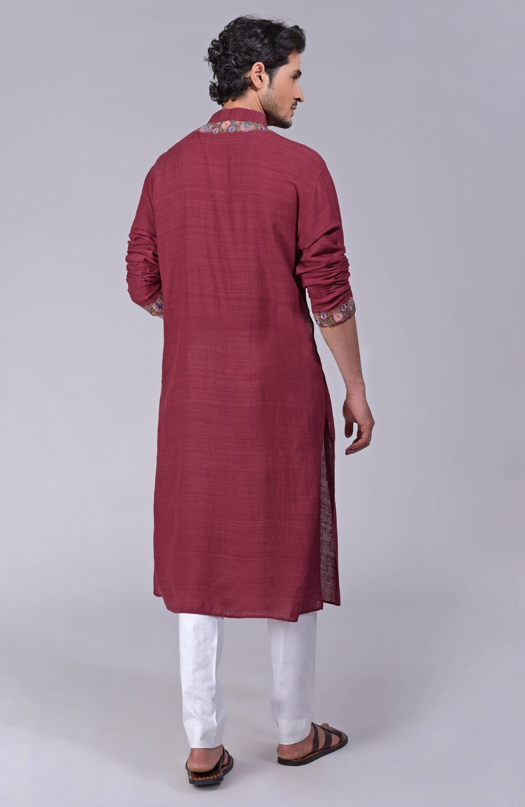 Maroon kurta with detailed Kashidakari embroidery on placket, neckline, and sleeves.