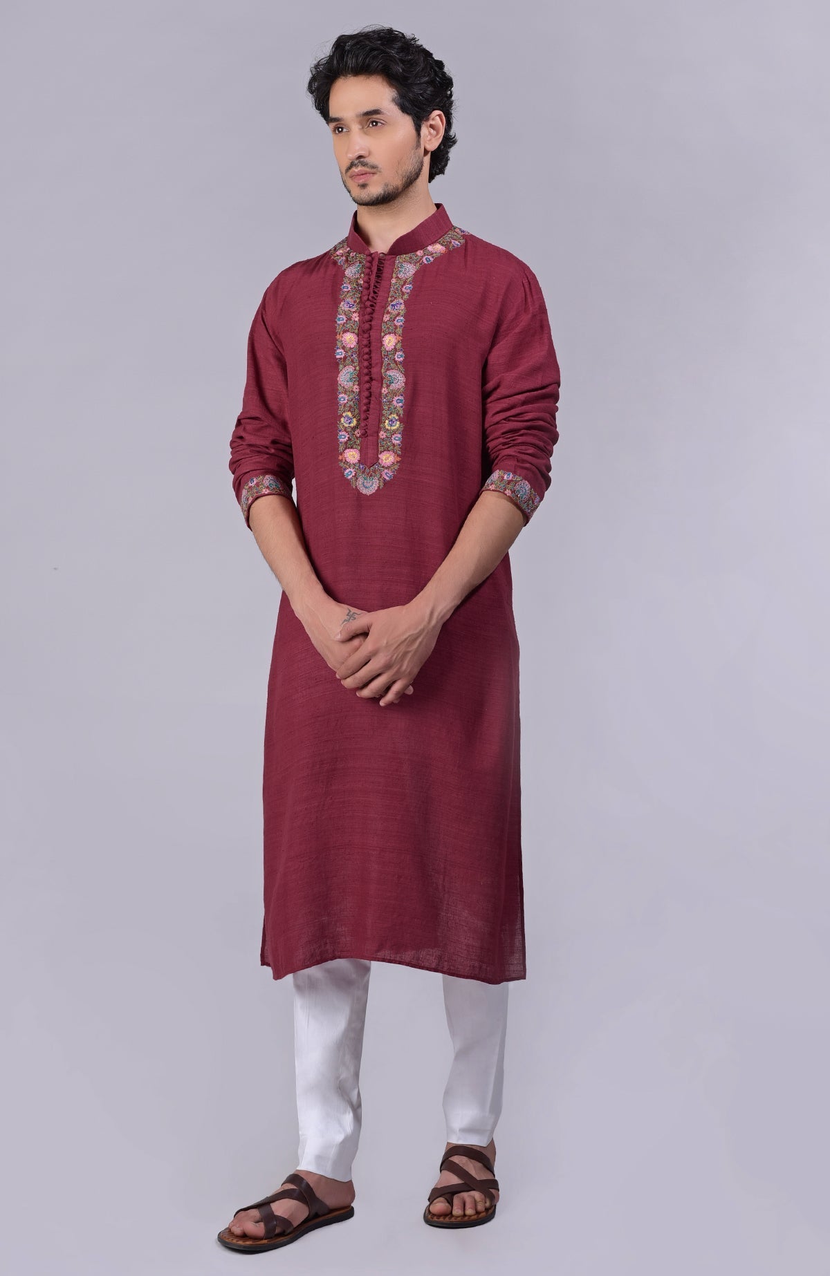 Maroon kurta with detailed Kashidakari embroidery on placket, neckline, and sleeves.