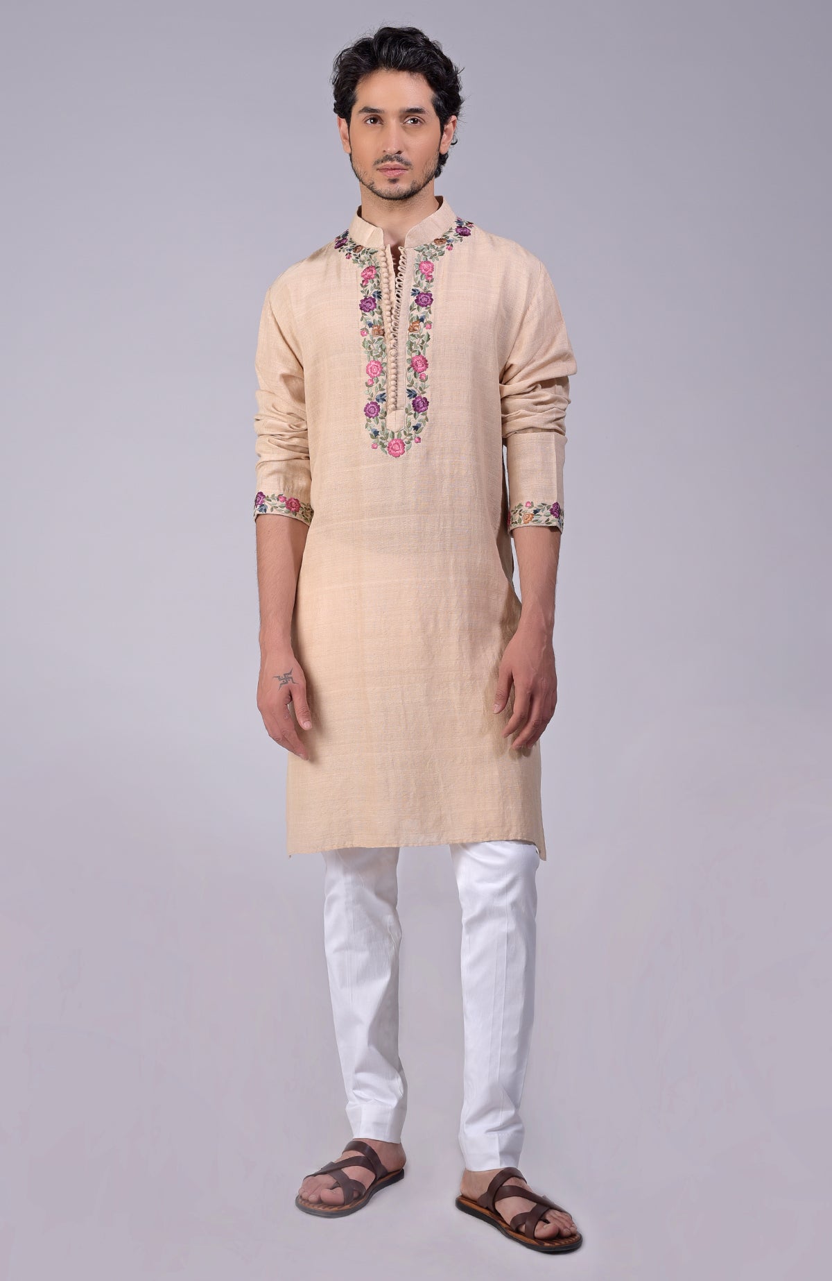 Beige kurta with Parsi Gara embroidery on placket, neckline, and sleeve ends with loop buttons