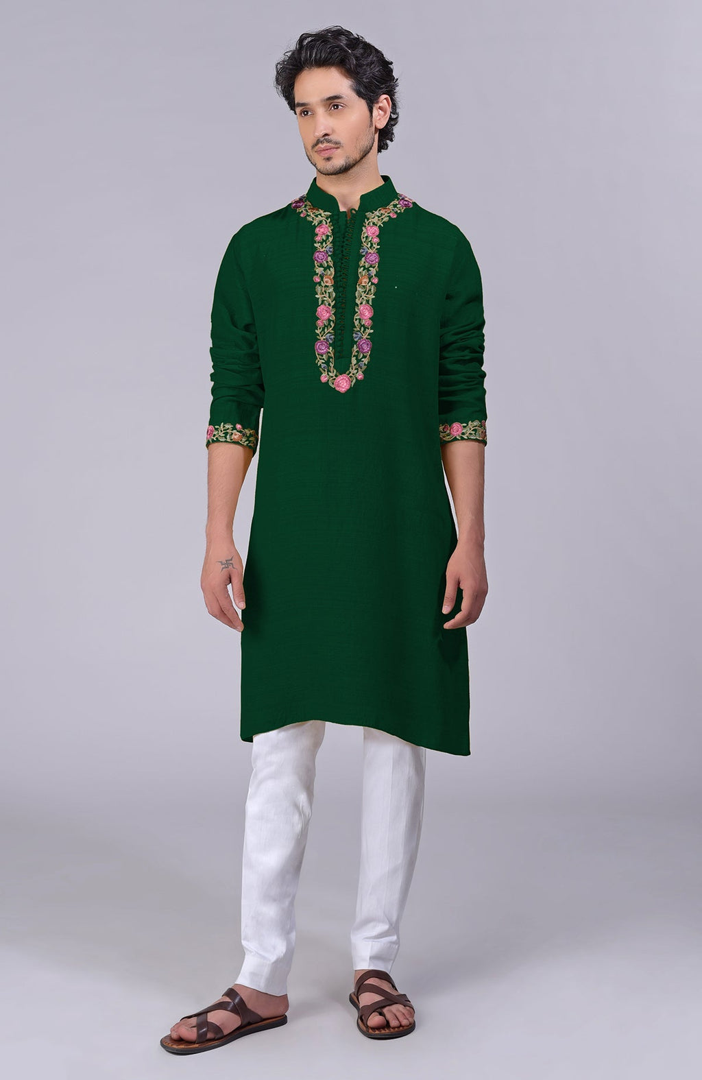 Bottle green kurta with Parsi Gara embroidery on placket, neckline, and sleeves.