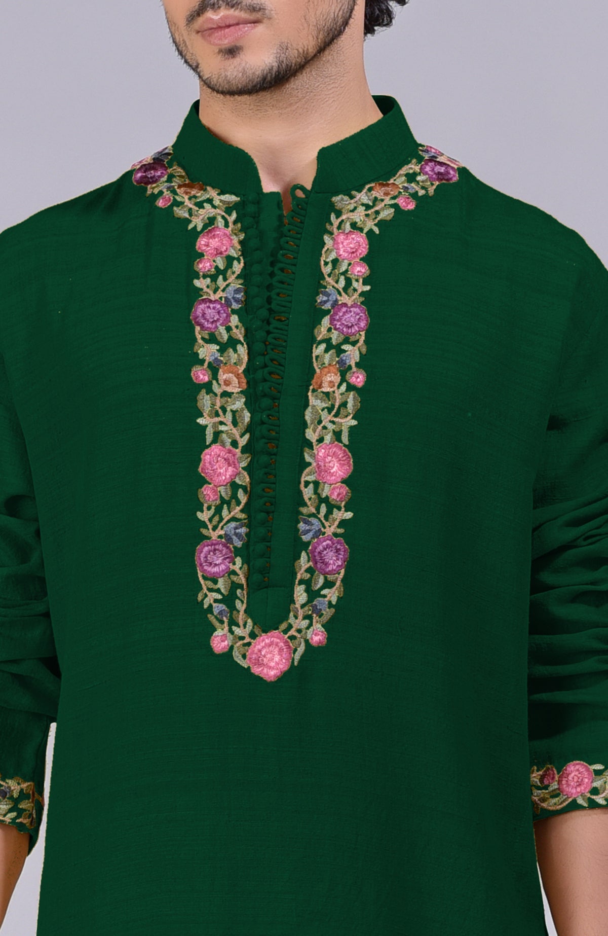 Bottle green kurta with Parsi Gara embroidery on placket, neckline, and sleeves.